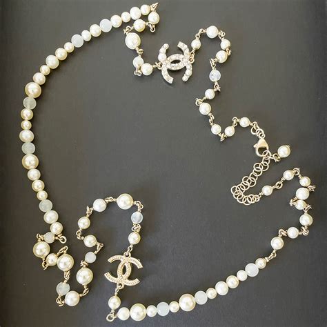 chanel necklace with black cc pendant|long chanel necklace with pearls.